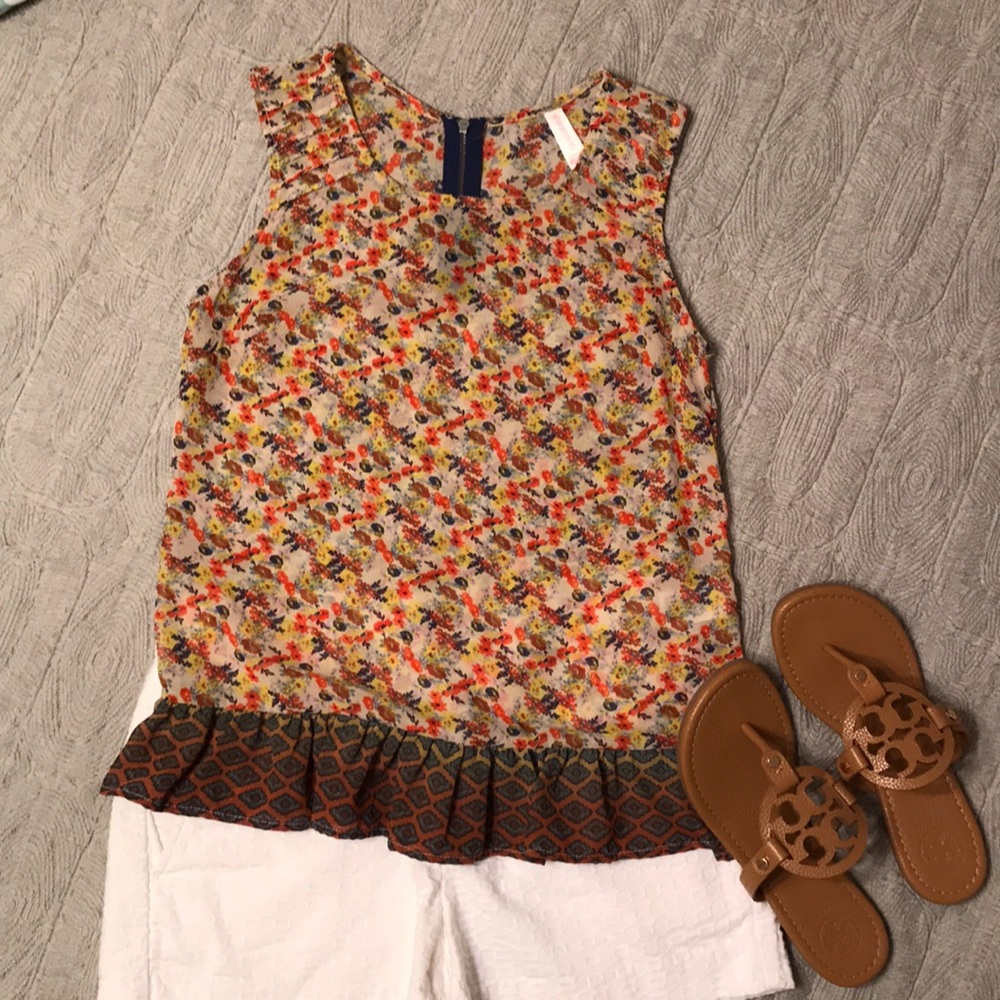 Cute sheer tank with ruffle bottom!